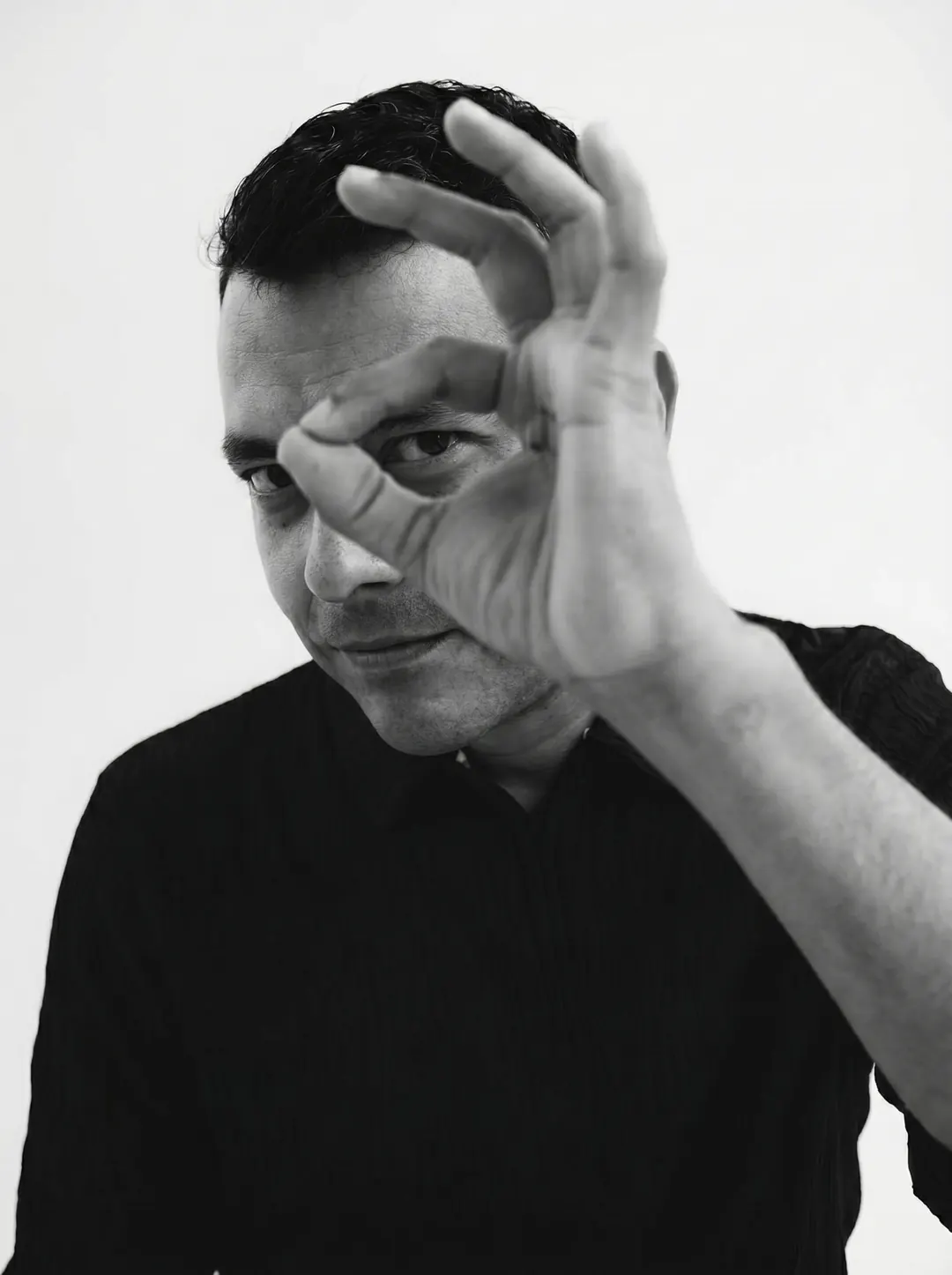 Daniel Garrido making an OK sign over his eye